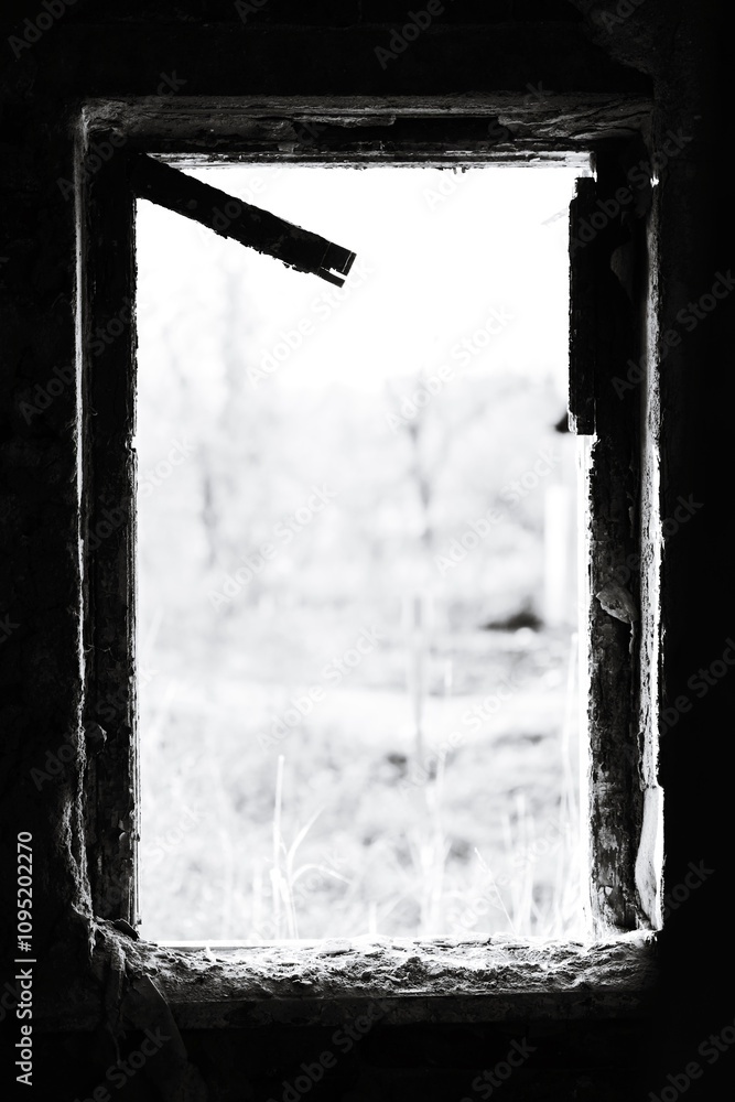 Poster a black and white photo of a window in a building, suitable for use as a decorative element or to ad