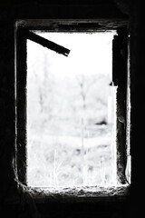 Fototapeta premium A black and white photo of a window in a building, suitable for use as a decorative element or to add vintage flair to a design.
