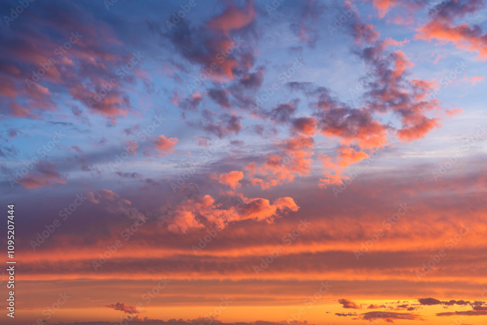 Wall mural glowing real sky at sunset texture background overlay. dramatic red and orange clouds.