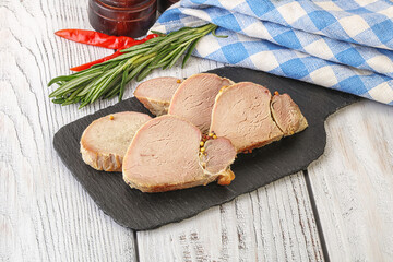 Baked pork tenderloin served rosemary