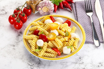 Italian pasta with mozzarella and tomato