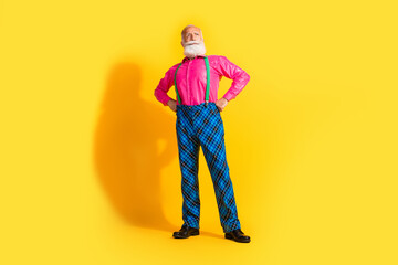 Full length photo of fashionable old gentleman confident posing wear glamour garment suspenders isolated bright yellow color background