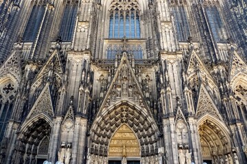 Fototapeta premium Exterior view of a Cathedral in Cologne with its two towers and Gothic architecture.