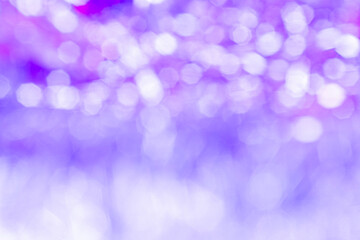 blurred bokeh background. christmas and new year holiday purple violet background dots
