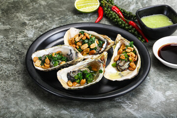 Open half oysters with green onion