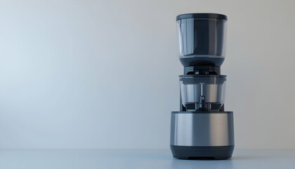 Sleek modern kitchen appliance, stainless steel and black, against a minimalist light grey background. Perfect for healthy living, smoothies, and juices.