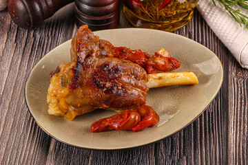 Baked lamb shank with vegetables