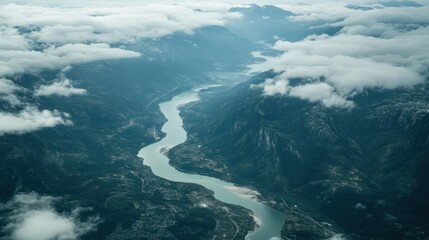 Aerial View Serpentine River, Mountainous Landscape, Cloud Cover