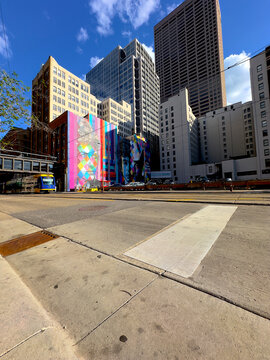 Metro Train Passing Downtown Minneapolis with Bob Dylan Mural in the Background. May 9, 2024.