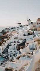 A photo of the beautiful Santorini in Greece, with pastel colors, white buildings with blue details, and a sunset visible in the distance during the golden hour