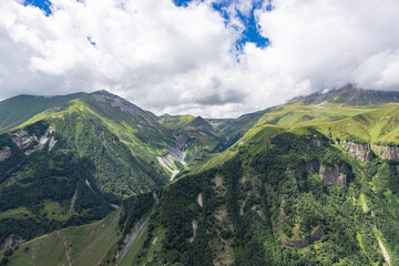 Caucasian mountains near Gudauri village. Kazbegi mountain behind the clouds. Georgia