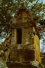 Fototapeta premium lycian stone carved sarcophagi in the middle of mediterranean town Kas in Turkey, timeless open air landmark monument