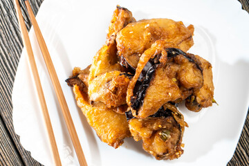 Fried eggplants with meat on a wooden background. Food concept. Chinese food.