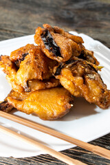Fried eggplants with meat on a wooden background. Food concept. Chinese food.