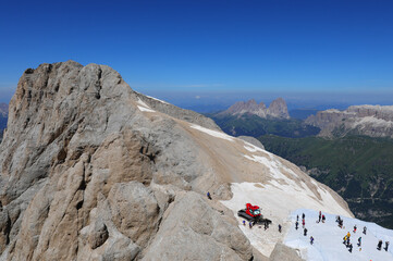 MARMOLADA mountain in northern Italy and people walking on the protective sheet put up to preserve...