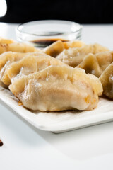 Dumplings with meat on a white background. Chinese dumplings are a traditional dish for Chinese New Year. Food concept. Chinese food.