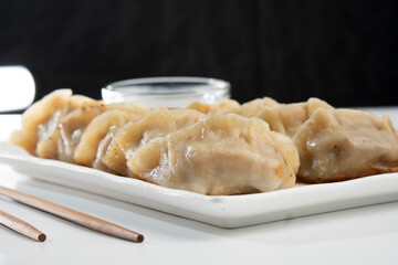 Dumplings with meat on a white background. Chinese dumplings are a traditional dish for Chinese New Year. Food concept. Chinese food.