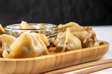 Dumplings with meat on a white background. Chinese dumplings are a traditional dish for Chinese New Year. Food concept. Chinese food.