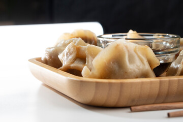 Dumplings with meat on a white background. Chinese dumplings are a traditional dish for Chinese New Year. Food concept. Chinese food.