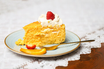 Delicious slice of cake. Homemade pumpkin cheesecake on a plate background. Tasty dessert idea with creamy texture. Whipped cream pastry. 