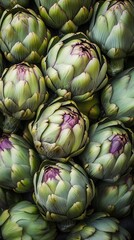 Fototapeta premium Fresh artichokes stacked in an elegant arch, showcasing their vibrant green petals and purple accents for a natural display, green food background