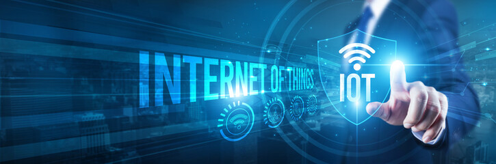 internet of things. Businessman hand touches a shield, IoT security is essential. The concept represents safeguarding connected devices, network integrity, data privacy, and operational resilience.