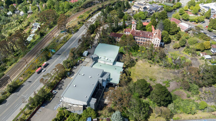 Fototapeta premium Drone aerial photograph of the old Renaissance Centre building adjacent to the Great Western Highway near the local Cinema precinct in Katoomba in the Blue Mountains in New South Wales, Australia.