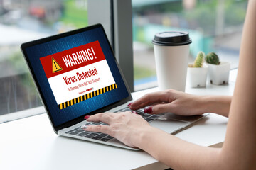 Virus warning alert on computer screen detected modish cyber threat , hacker, computer virus and...