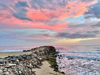 pink sunset on the beach over the pear