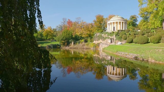 Sunny autumn view of Schlosspark Eisenstadt park with Leopoldinentempel alcove, Austria, Europe. Stunning morning of Eisenstadt, small Austrian city. 4K video (Ultra High Definition).