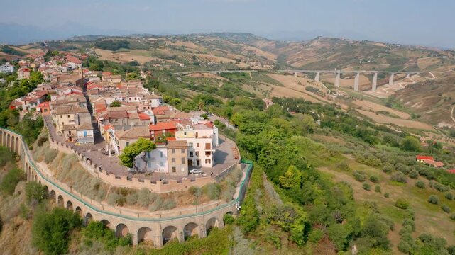 4k drone flight back footage (Ultra High Definition) of Silvi Paese town. Stunning morning scene of Italian countryside. Beautiful summer scenery. 4K video (Ultra High Definition).