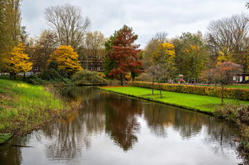 Colorful autumn reflections in the Erasmus park in Amsterdam, The Netherlands