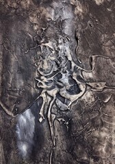 Contemporary high texture abstract painting in natural gold dark brown background composition