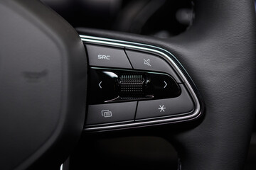 The modern cars steering wheel control panel boosts convenience and performance