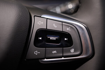 The modern cars steering wheel control panel boosts convenience and performance