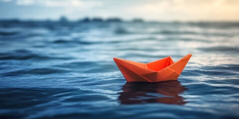 Orange Paper Boat Sailing Calm Ocean Waters