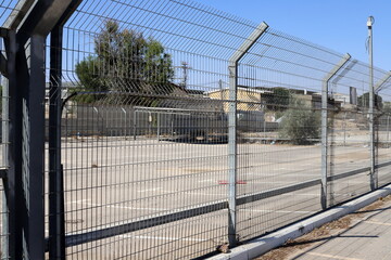 Fototapeta premium Metal fence in a city park in Israel.