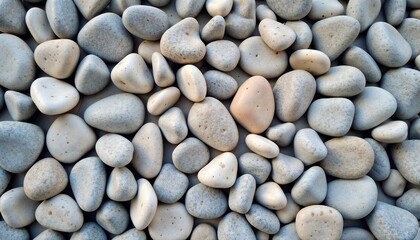 Collection of smooth stones on a light background for decoration
