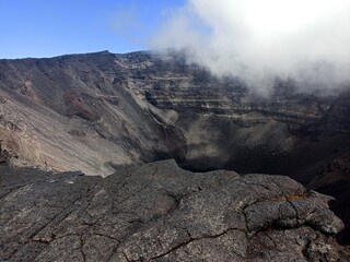Crater Dolomieu, piton de la fournaise, halfway covered by clouds in La Réunion 