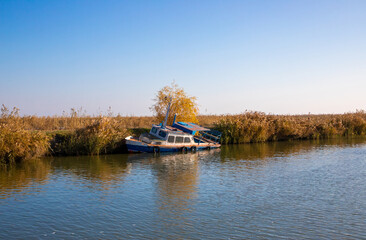 An old wrecked boat, abandoned on the shore