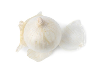 Fresh onion with peels isolated on white, above view