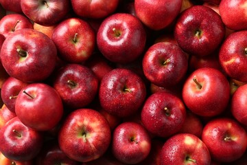 Fresh ripe red apples as background, top view