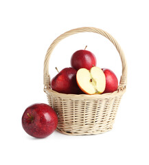 Fresh ripe red apples in wicker basket isolated on white