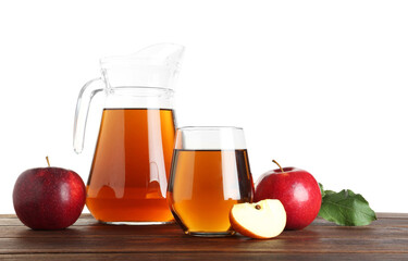 Tasty apple juice in glass, jug and fresh fruits on wooden table against white background