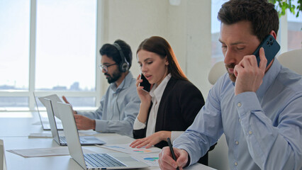 Professional team businessmen and businesswoman solving business issues sales answer mobile phone...