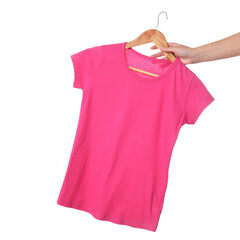 Woman holding hanger with beautiful t-shirt on white background, closeup