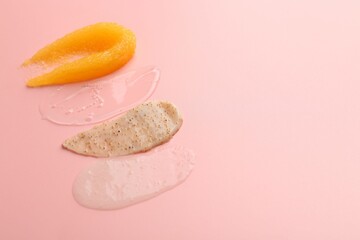 Samples of cosmetic products on pink background, space for text. Skin care