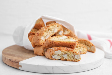 Traditional Italian almond biscuits (Cantucci) on light table, closeup