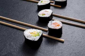 sushi with chopsticks