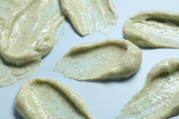 Smears of body scrub on light background, closeup